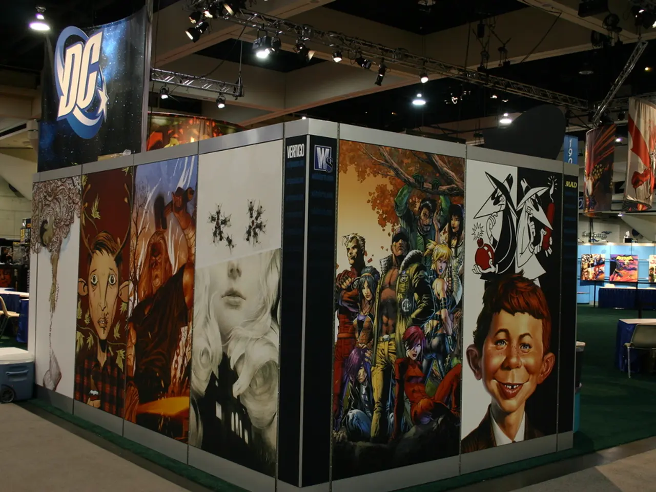 In this image we can see hoardings, tables, chairs, banners, lights, ceiling, wall, floor, carpet,...