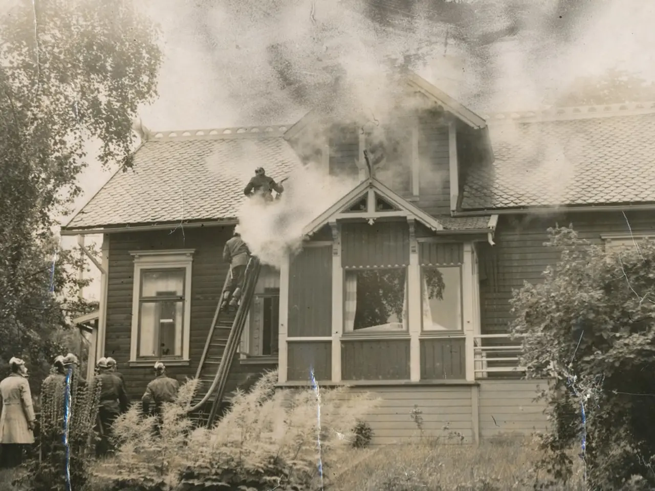 In this image in the center there is a building. In front of the building there are persons and...