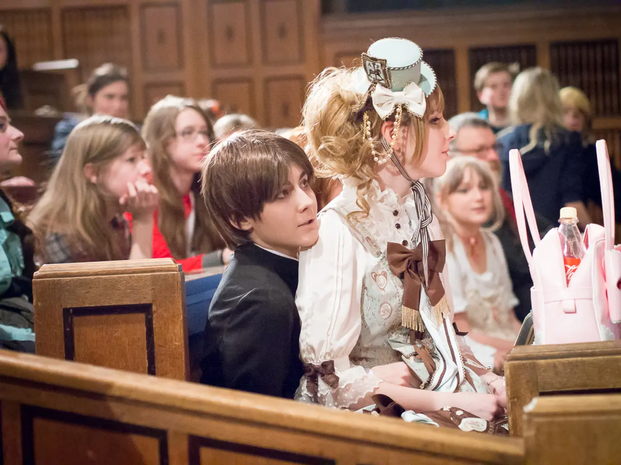 in this image we can see there are some boys and girls sitting on the bench and on the right side...