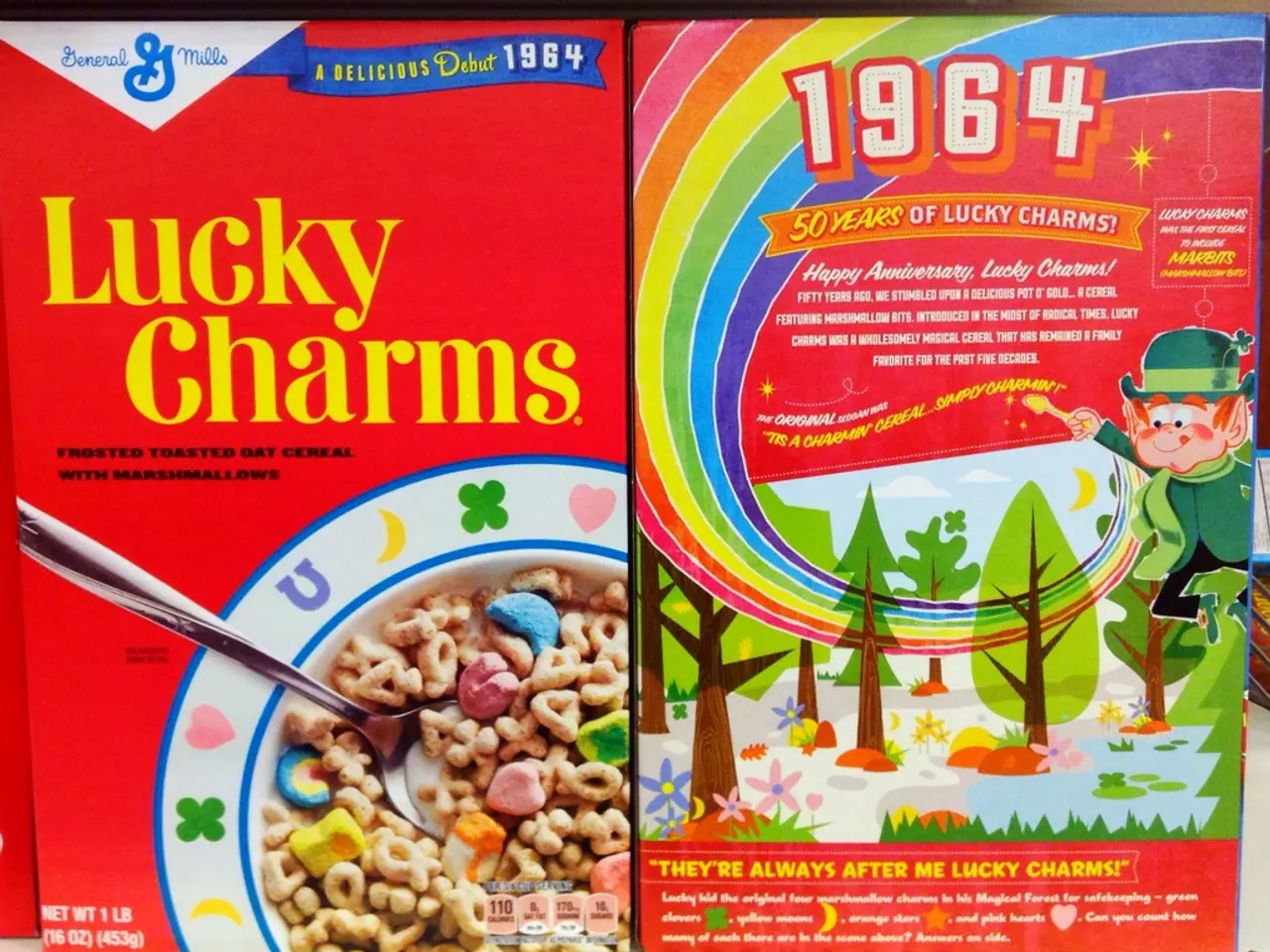 In the image there are two cereal boxes with graphic images on it beside each other.