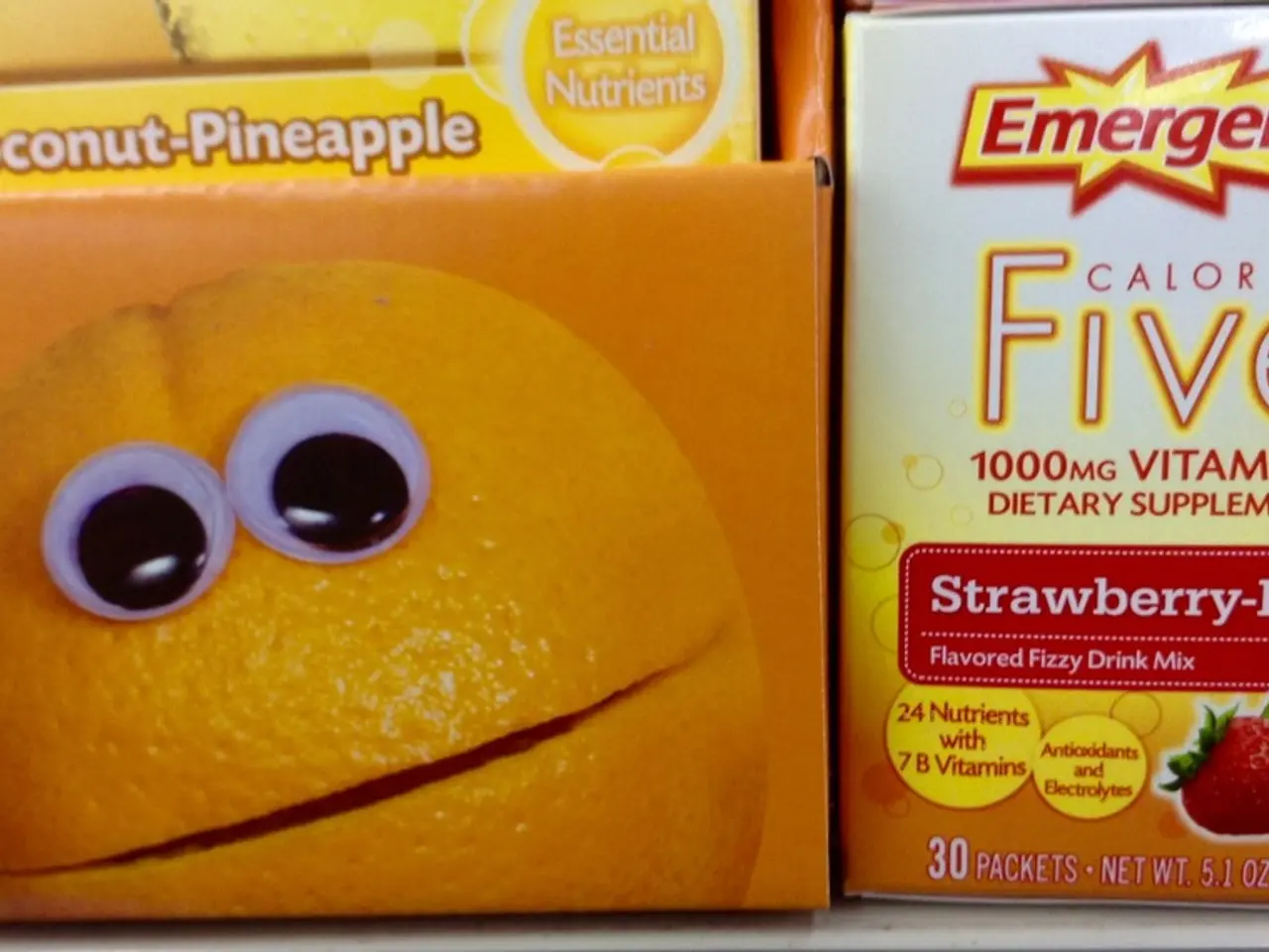 In this image I can see there are some drink packet in the foreground. And on the right side there...