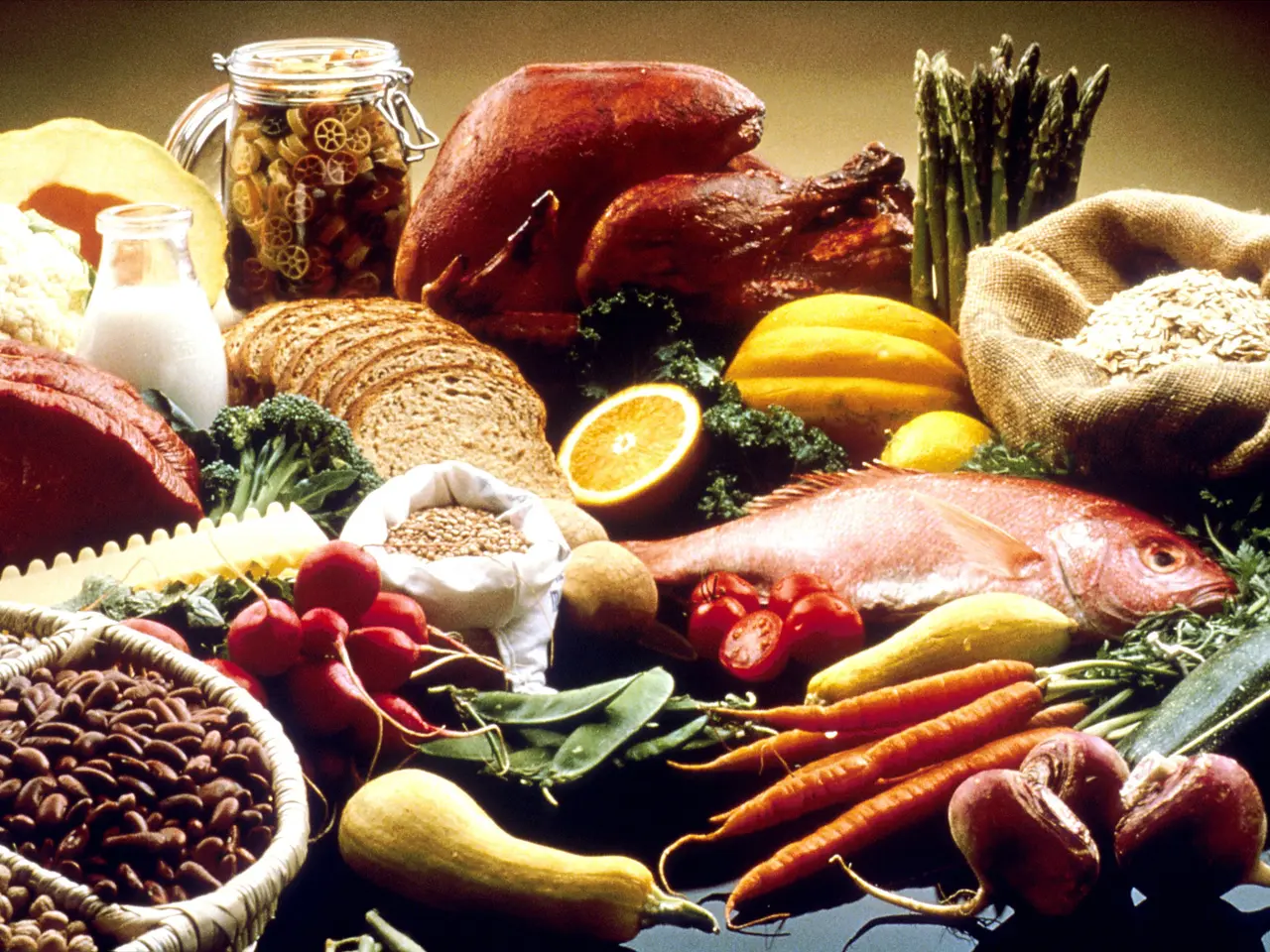 The image shows a table topped with a variety of fruits and vegetables, including a fish,...