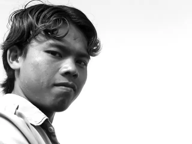 It is the black and white image of a man.