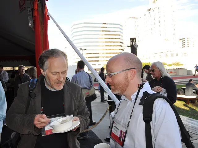 This image is clicked outside. There are buildings in the top. There so many people in this image....