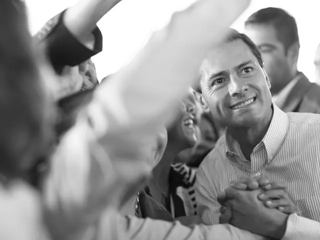 This is a black and white image. Here I can see few people are smiling. It seems like they are...