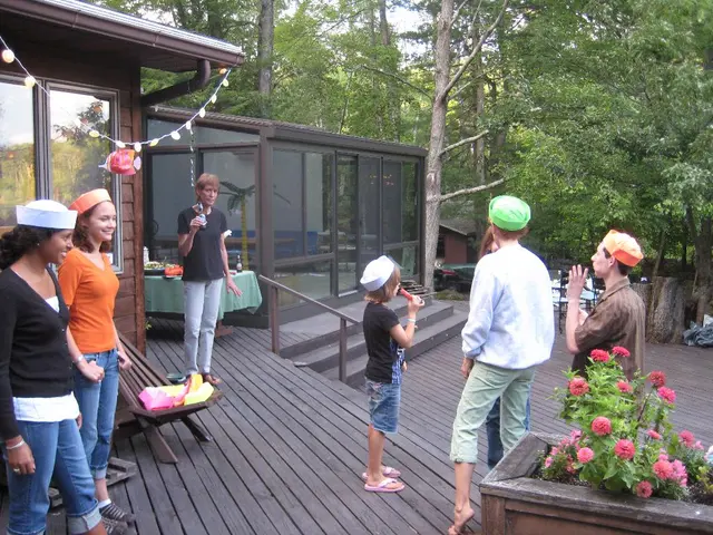 This picture describes about group of people, few people wore caps, on the right side of the image...