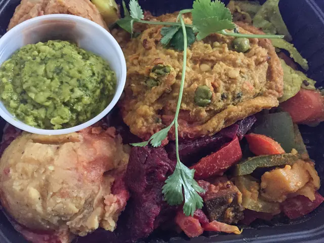 In the image there is a plate with different kinds of food items and also there is a white bowl...