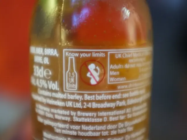 In this image in the center there is a bottle with some text written on it.