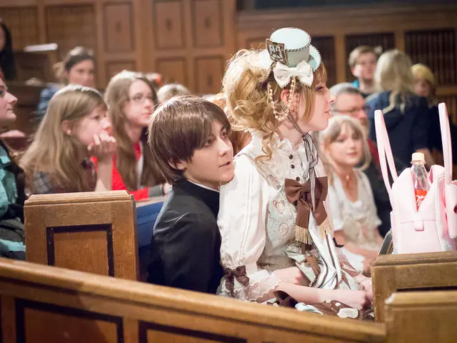 in this image we can see there are some boys and girls sitting on the bench and on the right side...