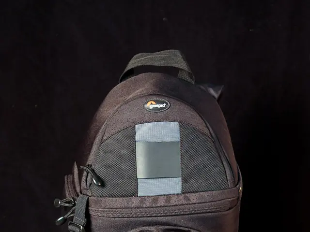 In this image I can see a bag with the brand name written on it and it is on the stool.