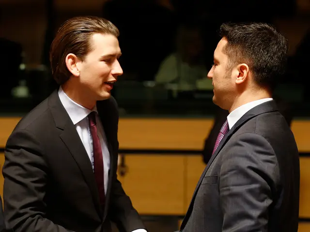 In the picture we can see two men standing and shaking the hands with each other and they are...