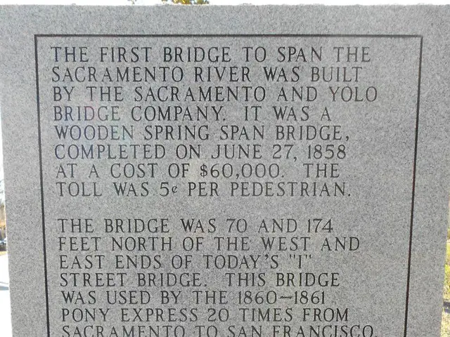 In this image I can see a headstone on which matter is written.