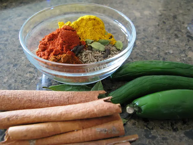 In this image there is a glass bowl in the middle. In the glass bowl there are cumin...