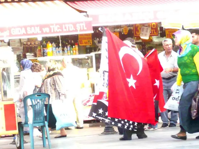 This picture describes about group of people are walking on the road, and few are standing, in the...