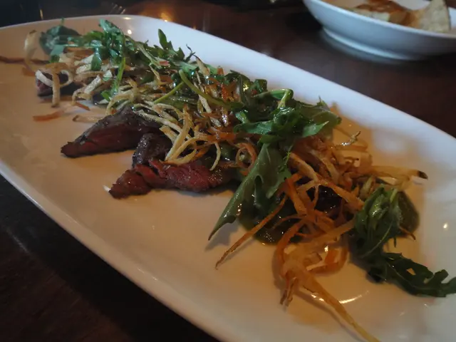 In this image we can see food placed in a serving plate and a serving bowl and are placed on the...