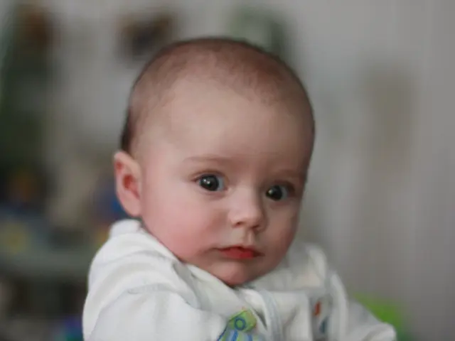 We can see a kid. In the background it is blur.