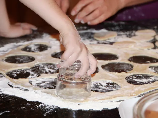 In this picture there are flour, batter, glass, people and a box.