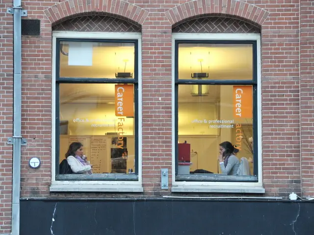 In this image there is a building in the middle. On the left side there is a pipe. There are two...