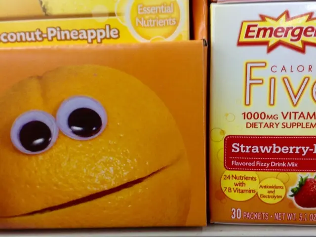 In this image I can see there are some drink packet in the foreground. And on the right side there...