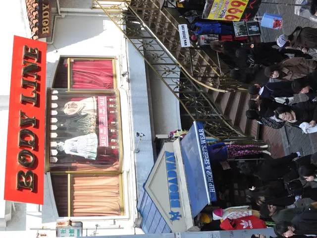 This picture is taken outside, there are group of people roaming on the pathway. Towards the right...