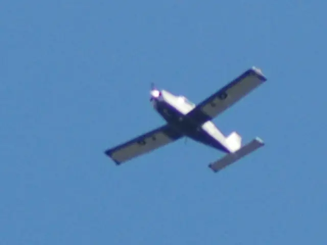 This picture shows a jet plane and we see a blue sky.