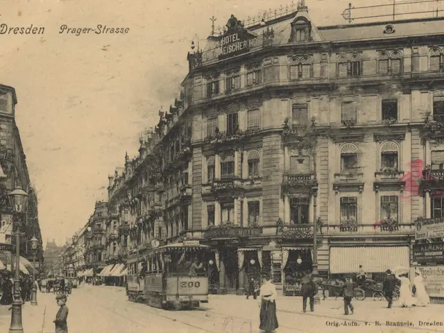 The image shows an old black and white photo of a city street in Dresden, Germany. We can see a...