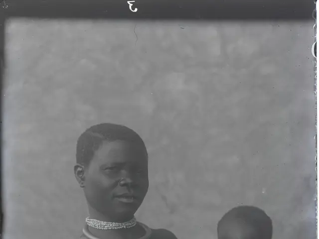 The image shows an old black and white photo of a woman from the Omo Valley Tribe in Ethiopia,...