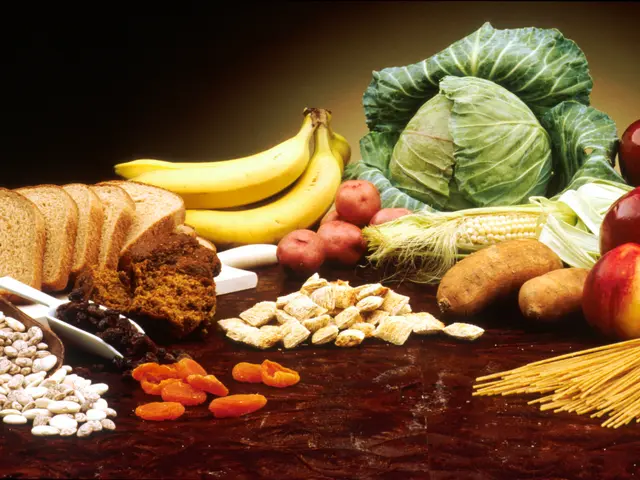 The image shows a table topped with a variety of fruits and vegetables, including apples, bananas,...