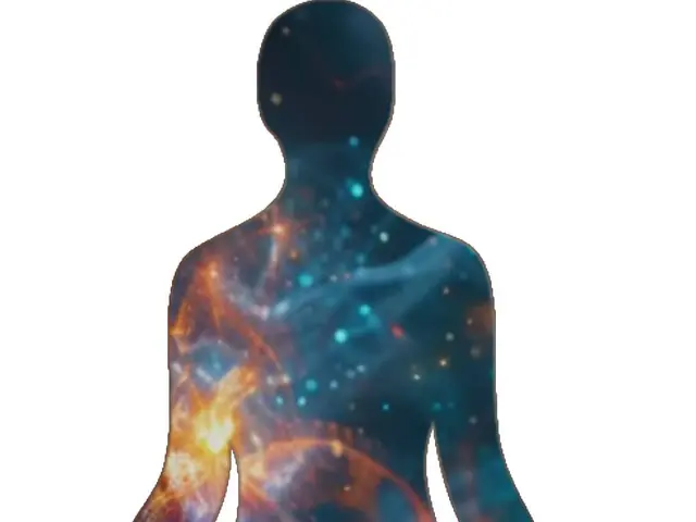 The image shows a silhouette of a person sitting in a lotus position with a nebula in the...