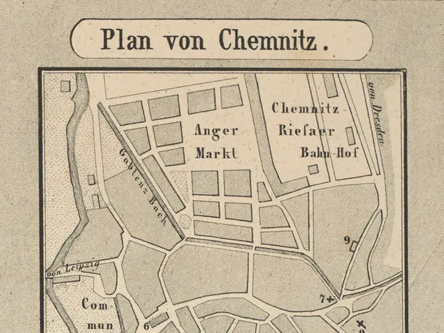 The image shows a paper with a map of the city of Chemnitz, Germany, with text written on it. The...