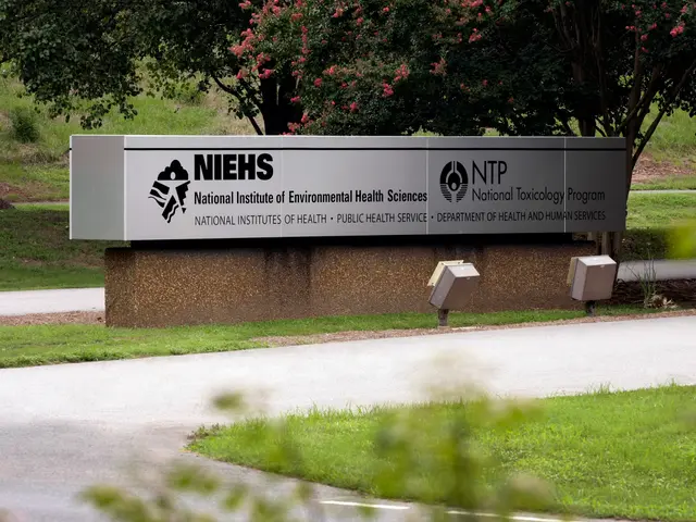 The image shows a sign for the National Institute of Environmental Health Sciences (NIEHS) in front...