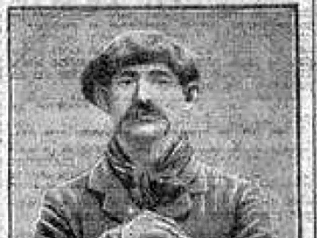 The image shows a black and white photo of a man with a mustache, believed to be J.J. Amundsen, the...