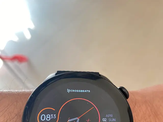 The image shows a person wearing a black Crossbeats Smartwatch on their wrist. The watch has a...