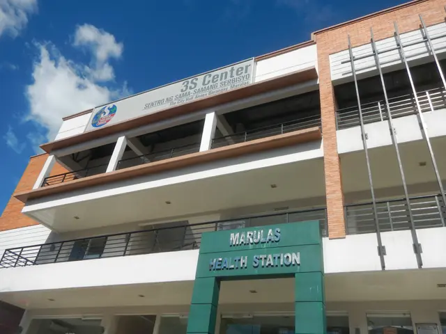 The image shows the Marulas Health Station in Manila, Philippines. It is a building with windows,...