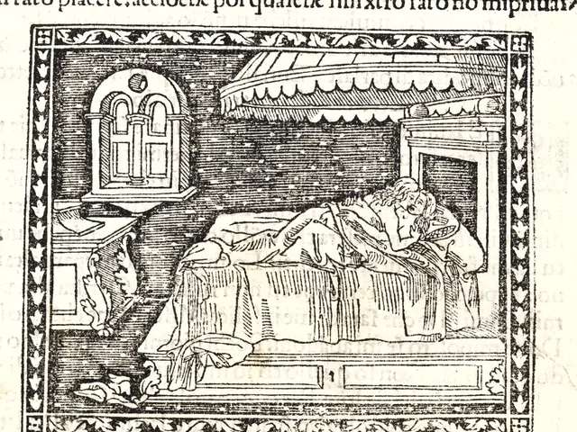 The image shows a man sleeping in a bed with a window in the background. He is lying on the bed...