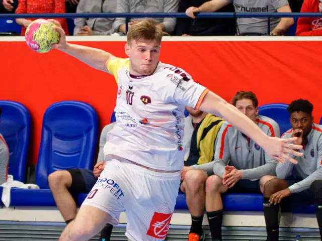 The image shows a man in mid-air, kicking a soccer ball on top of a court. In the background, there...