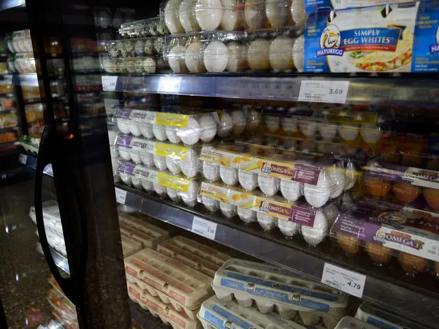 The image shows a grocery store with a refrigerator filled with lots of different types of eggs....