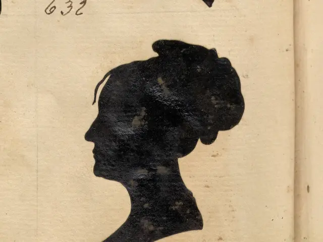 The image shows an old book with a black silhouette of a woman's head on it. The book is open,...