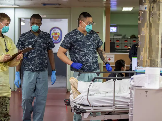 The image shows a group of men in scrubs and masks walking down a hospital hallway, with a person...