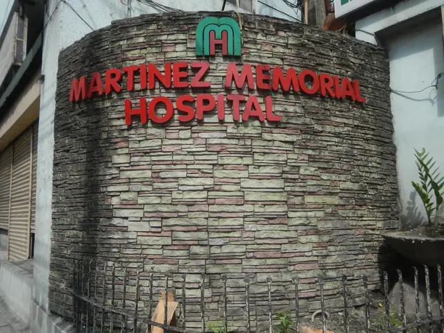 The image shows the Martinez Memorial Hospital in Manila, Philippines. It is a building with...