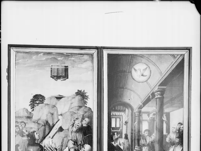 The image shows a black and white photo of a group of people in a room, framed in a photo frame....