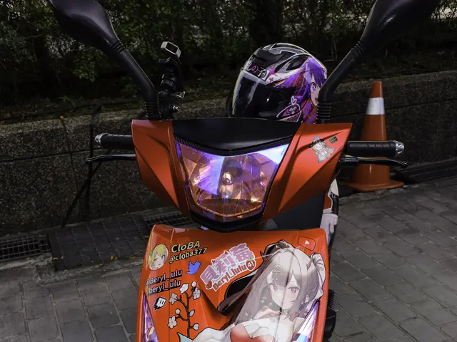 The image shows an orange scooter parked on the side of a street, with a helmet on it. In the...