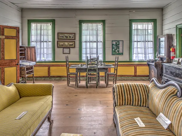 The image shows a living room filled with furniture such as sofas, chairs, and a table, as well as...