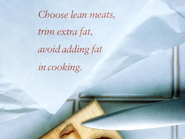 The image shows a wooden cutting board with two pieces of meat on it, a knife beside it, and a...