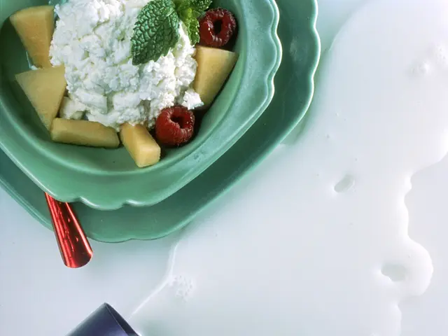 The image shows a table with a bottle of milk and a bowl of food on it. The text on the image reads...