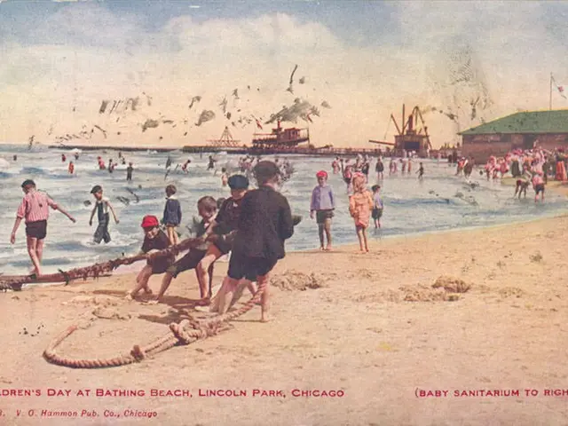 The image shows an old postcard of children playing on the beach at Bathing Beach in Lincoln Park,...