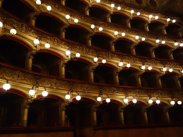 The image shows an inside view of the auditorium of the Theatre Royal in London, England. It is a...