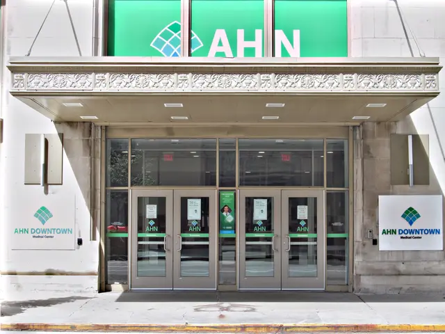 The image shows the entrance to a building with a green and white sign that reads "ahn downtown"...