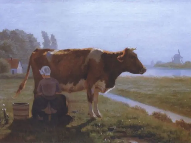 The image shows a woman milking a cow in a field, surrounded by lush green grass, plants, and...