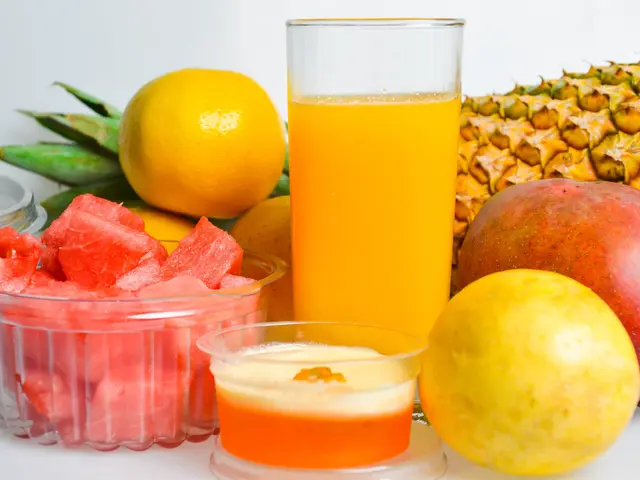 The image shows a table topped with a glass of orange juice, a bowl of watermelon, a pineapple, a...